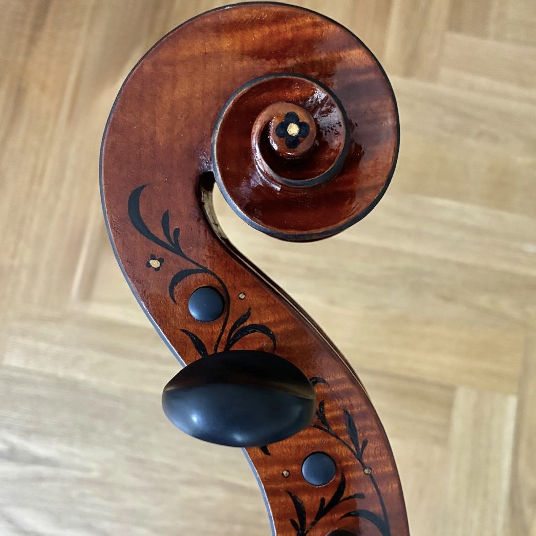 Decorated scroll of the Wordsworth Quartet violin, with inlaid floral motifs